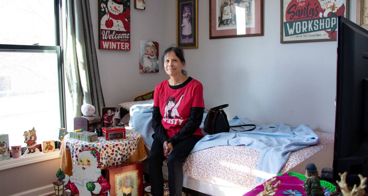 Woman sitting on bed